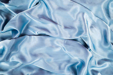 Light blue satin background and texture. Grooved of blue fabric abstract. Top view with empty space. High quality photoの写真素材