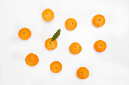 Fruit pattern of fresh orange tangerine or mandarin isolated on white background. Flat lay, top...
