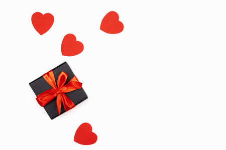 Black gift box with red bow with red hearts isolated on white. Holiday web banner. ... High quality photoの写真素材