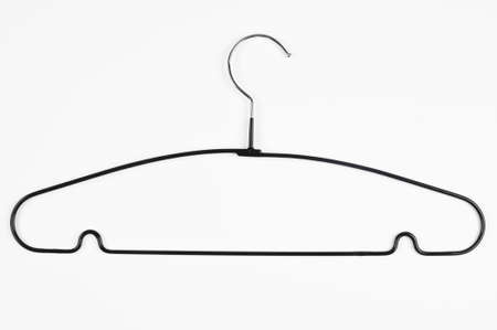 Metal black clothes hanger isolated on white, top view. High quality photoの写真素材