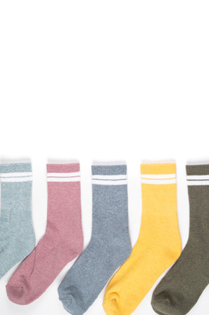 Close up of colorful socks isolated on white, cropped view. High quality photo