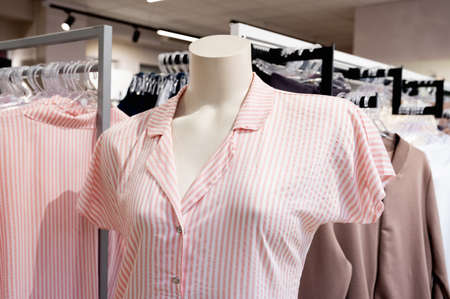 Closeup of pink striped pajama on mannequin in a fashion store showroom. High quality photoの写真素材