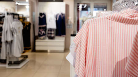 Women's underwear or homewear store, selective focus. Female clothes on hangers in fashion store showroom. High quality photoの写真素材