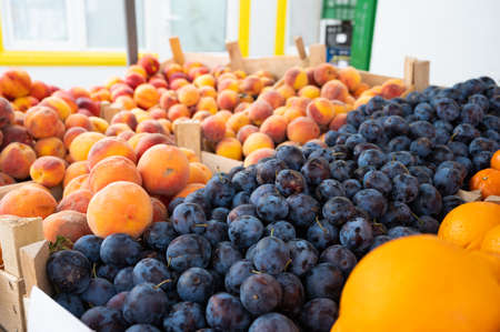 A selection of many fruits in a market. Fresh fruits at a farmers market. High quality photoの写真素材