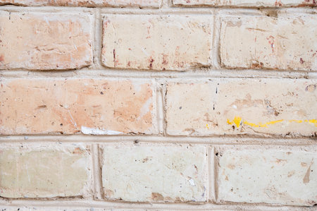 Old brick wall. Old beige brick wall texture background. High quality photoの写真素材
