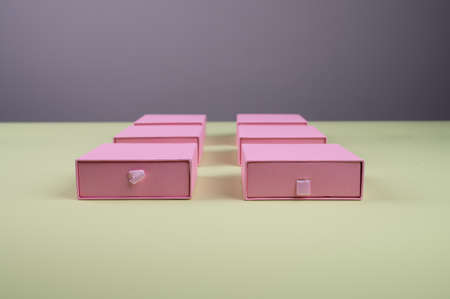 Set of pink cardboard boxes on pastel green background. High quality photoの写真素材