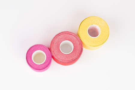 Top view of lifting or tape rolls isolated on white. alternative medicine concept.