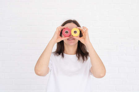 The beautician holds kinesio tapes in her hands on light background. anti-aging procedures.