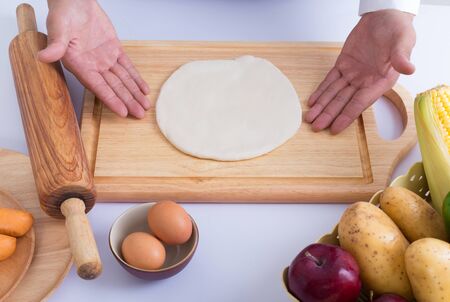 Male chef cooking concept - on white background