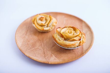 Mini apple rose pies - on white backgroundの写真素材