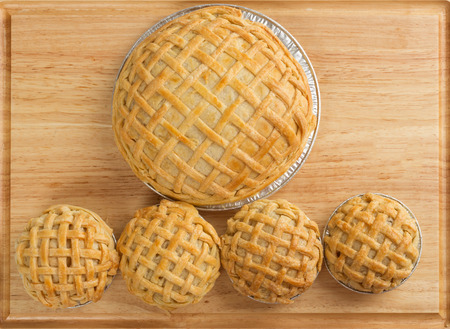 Coconut pie and Mini  coconut pies on wooden boardの写真素材
