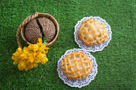 Mini coconut pies on green backgroundの写真素材