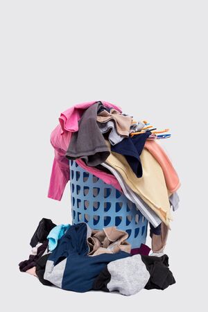 Basket with laundry isolated on white background.の写真素材