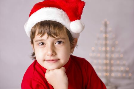 A Christmas kid with Santa hatの写真素材