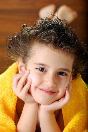 Kid with a yellow towelの写真素材