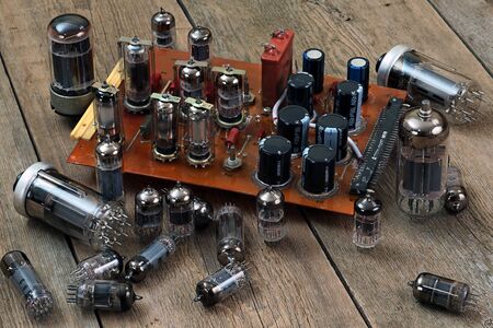 radio lamps and transistors on a wooden tableの写真素材