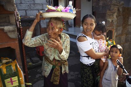 BALI, INDONESIA - AUGUST 24,2014: Balinese familyのeditorial素材