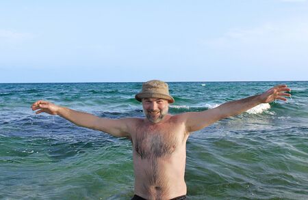 smiling man in the seaの写真素材