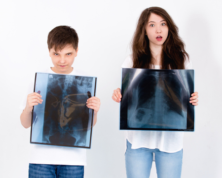 The patients look at their pictures. On a white background.の写真素材