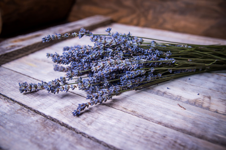 bouquet of lavender close-up on wooden surfaceの写真素材