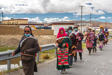 Unidentified Tibetan pilgrims around Sakya Monastery, Tibet - Chinaの写真素材