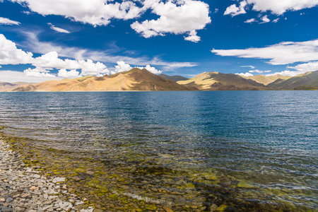 Shadow of Cloud over the clear turquoise lake, at Yamdrok Lake, Tibet, Chinaの写真素材