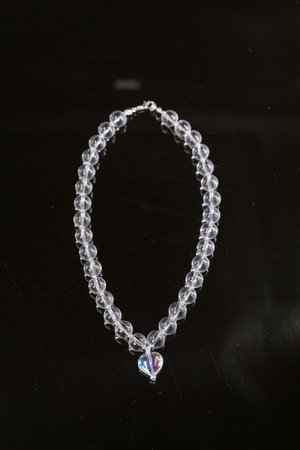 Glass necklace with big beads on a black backgroundの写真素材