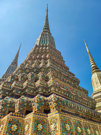 Decorated stupa with the multicolored mosaic at Wat Pho temple in Bangkok, Thailand.
