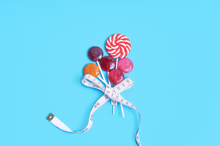 lollipop  sugar dental candy on blue backgroundの写真素材
