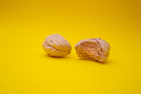 Marshmallow bites on a yellow backgroundの写真素材