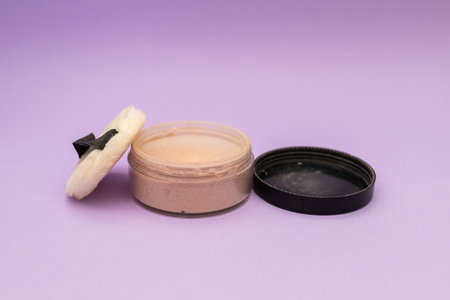 Facial Powder on Purple Backgroundの写真素材