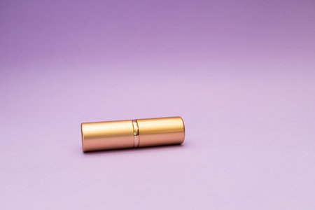 Golden tube on purple backgroundの写真素材