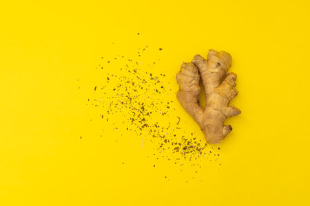 Ginger root on yellow backgroundの写真素材