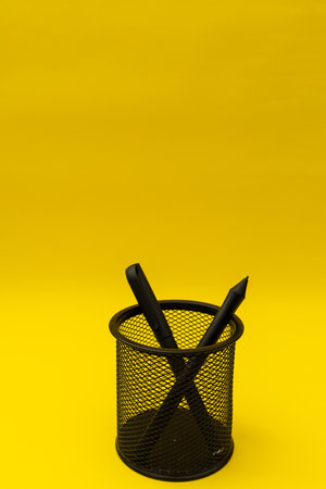 Black pen in a paper cup