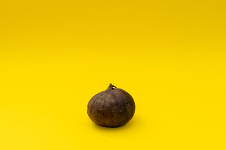 Juicy figs on a yellow backgroundの写真素材