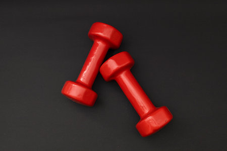 Little red weights on a black backgroundの写真素材