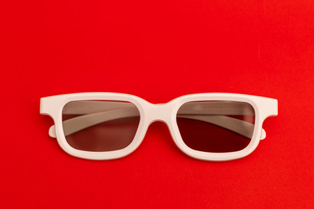 White-rimmed movie glasses on a bright background