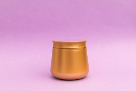 Body Butter in Gold Jar with Purple Background, a promotional shot of the productの写真素材