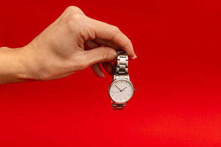 Wristwatch on red background, object photography for advertisingの写真素材