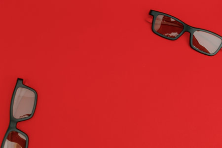 Movie sunglasses on a red backgroundの写真素材