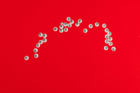 Plastic eyes for decor on a red background