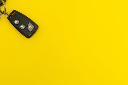 Car keys on yellow background
