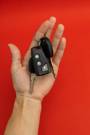Car keys on red background