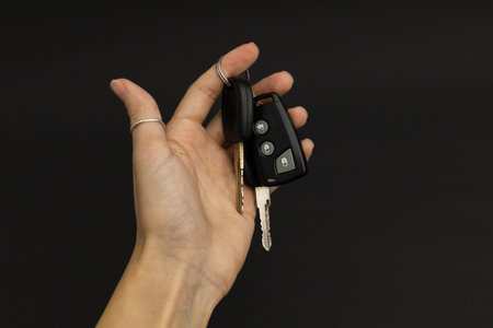 Car keys on black background