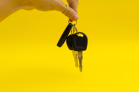 Car keys on yellow backgroundの写真素材