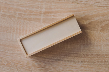 Dominoes in a wooden box on the table