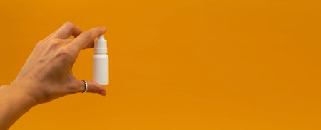 Orange banner with medicine bottles, medicine in advertising, copyspaceの写真素材