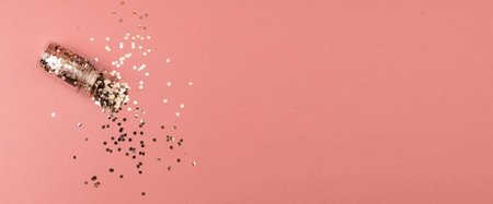Pink banner with bright glitter scattered in the background