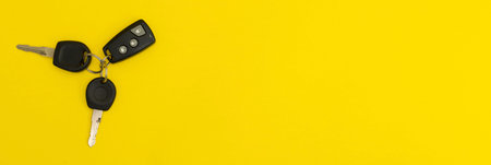 Car keys on yellow background
