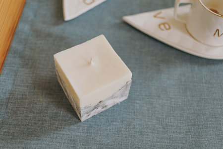 Wax candle with concrete baseの写真素材